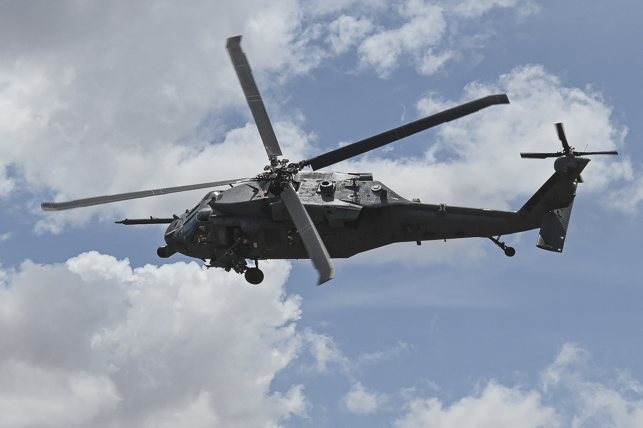 Image shows a helicopter flying.